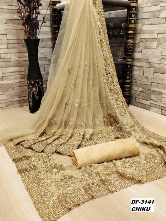 Precious Trending Extra Ordinary Beige Color Heavy Trendy Net Saree